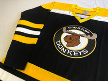 Laden Sie das Bild in den Galerie-Viewer, Custom hockey jerseys with the Swamp Donkeys team logo.