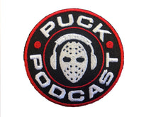 Load image into Gallery viewer, Flex-Fit Hat with the Puck Podcast embroidered twill crest $39 (White)
