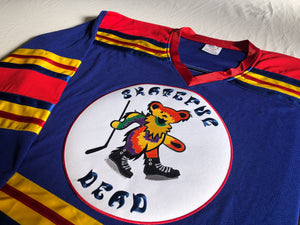 Custom hockey jerseys with the Skateful Dead team logo.