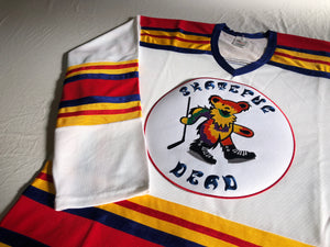 Custom hockey jerseys with the Skateful Dead team logo.